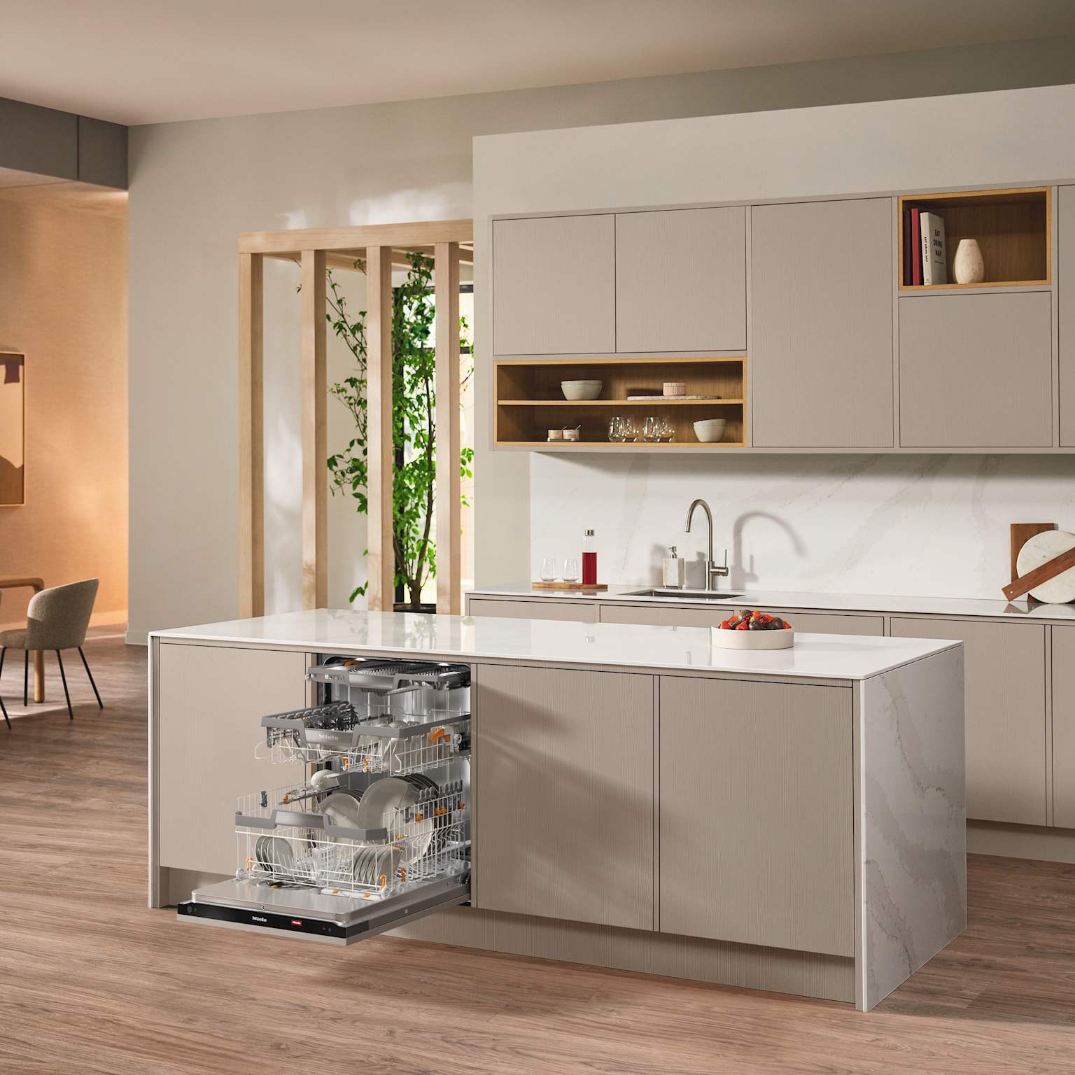 A Miele built-in dishwasher seamlessly integrated into a modern kitchen island