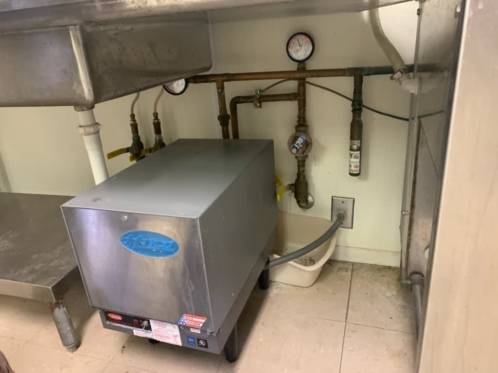 Plumbing and electrical connections for a commercial dishwasher booster heater